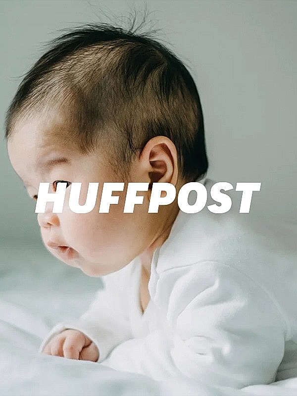 Baby looking curiously to the side.