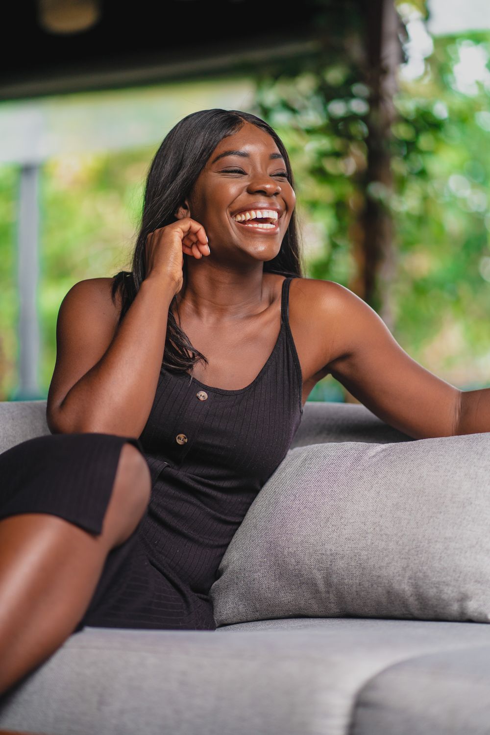 Athlete posing in activewear against concrete background.