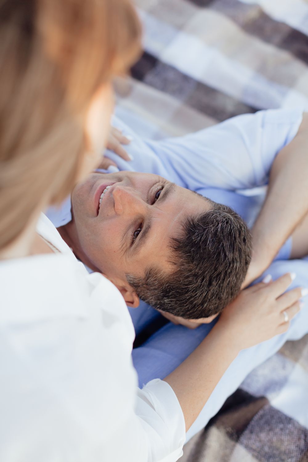 Athletic woman posing against concrete background.
