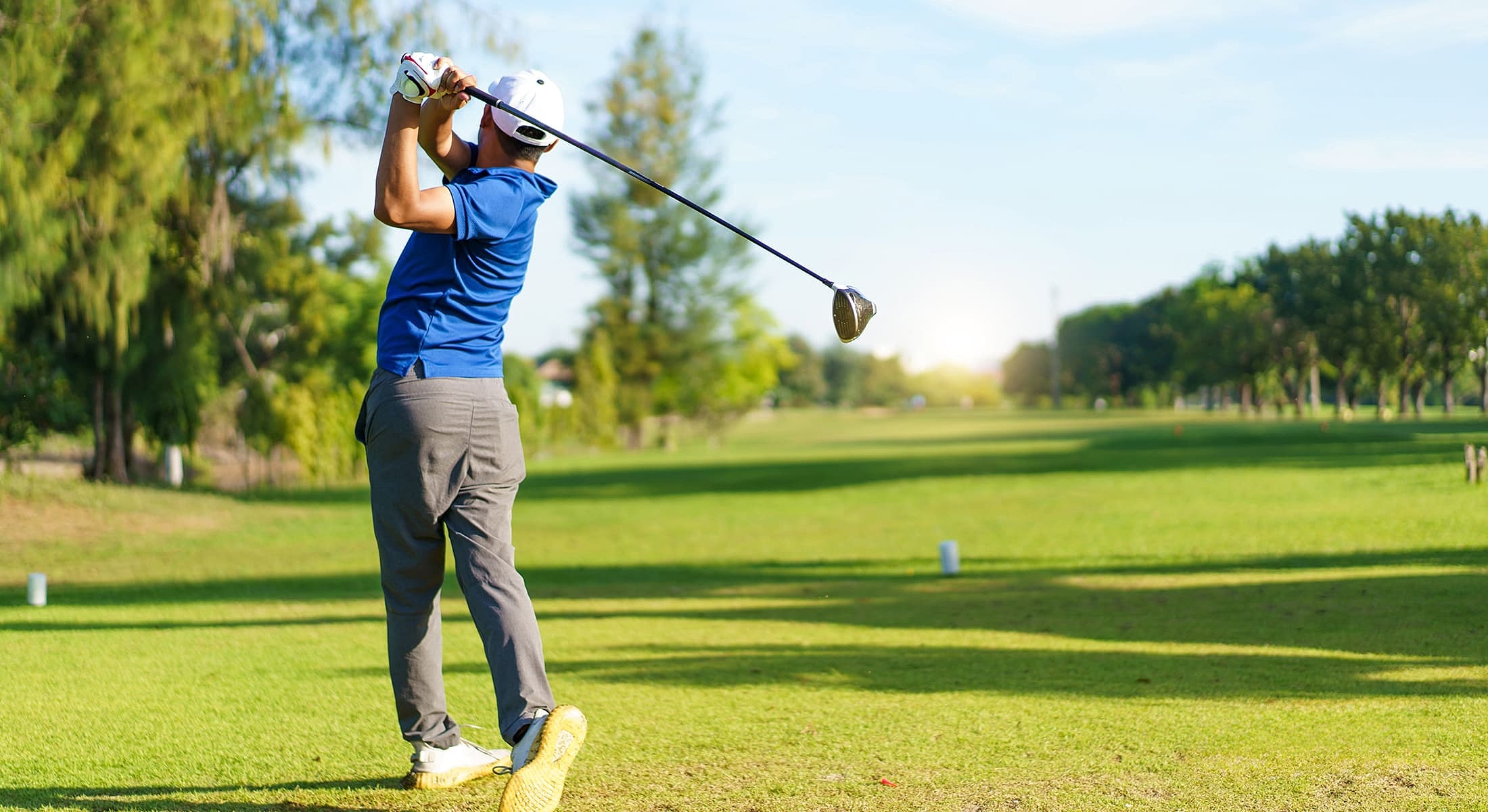 Smiling man in athletic wear at gym.